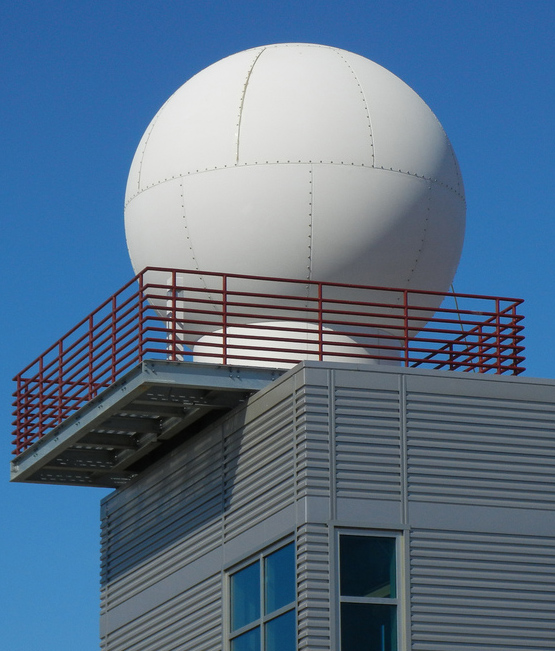 One of the instruments purchased by ARM through the American Recovery and Reinvestment Act of 2009 was this X-band scanning precipitation radar installed on top of the Barrow Arctic Research Center in Alaska. Transmitters mounted on the side of the building send radar data to the Site Data System.