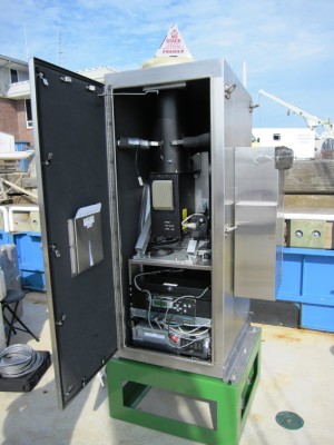 June15-mpl-low Shown here during installation on the aft deck of the RV Connecticut, the upgraded MPL includes a sleek new computer that can fit into smaller spaces. The laser window at the top is covered by a cone until the instrument is turned on. ARM file photo.