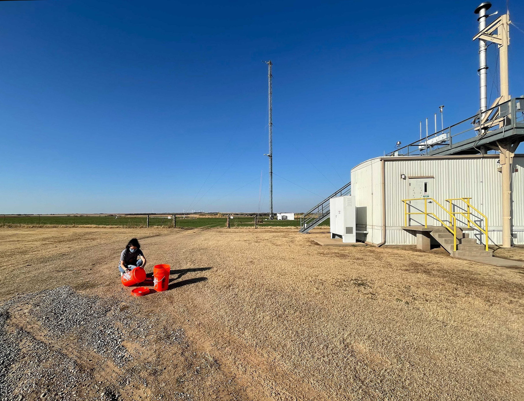 Kimberly Sauceda, a graduate student at West Texas A&M University, collects soil samples at ARM's Southern Great Plains observatory.