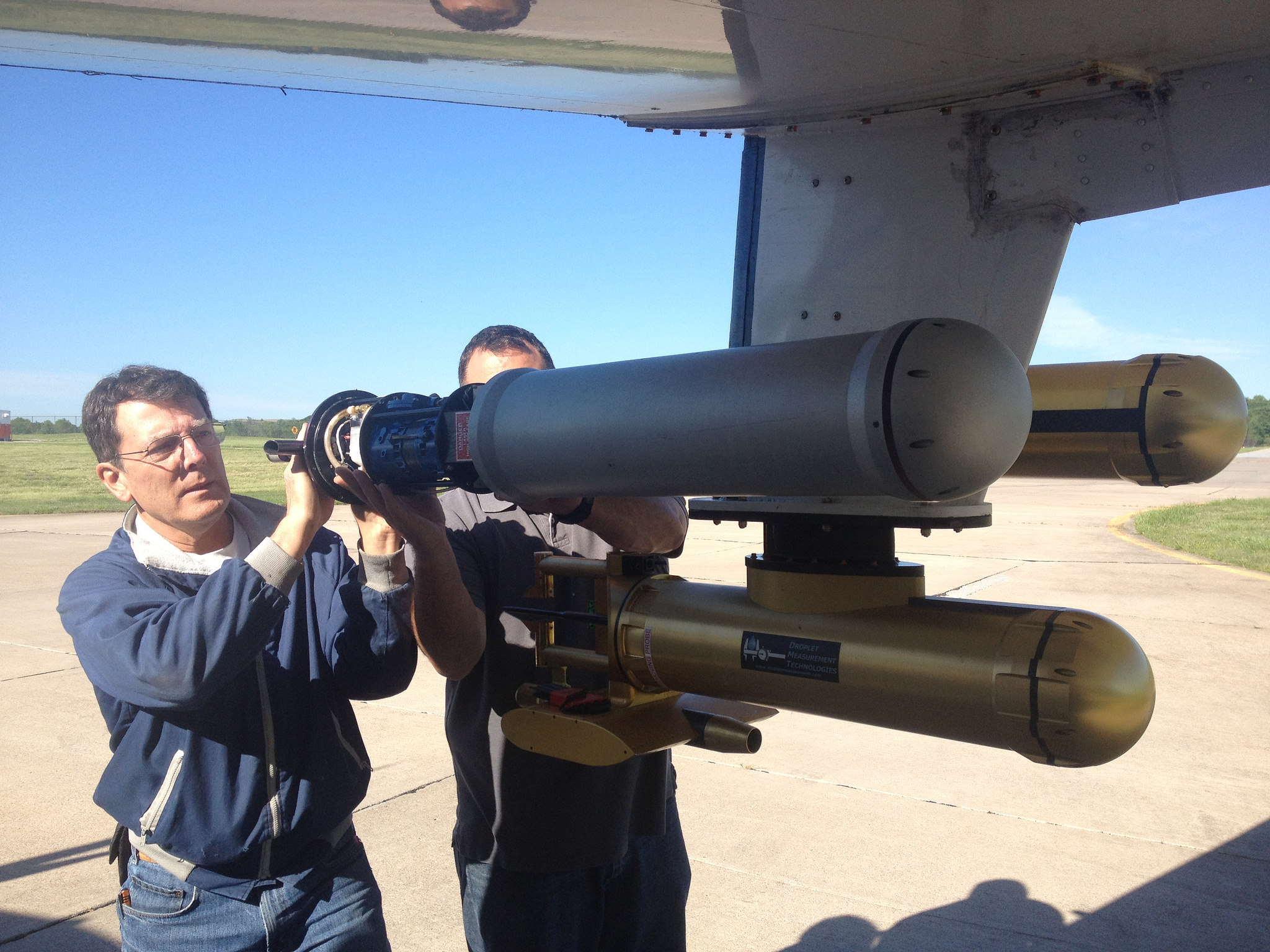 Scientist and AAF Payload Director John Hubbe removes an instrument from a G-1 pylon this spring during the first phase of the HI-SCALE experiment in Oklahoma.